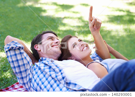 Love, relax and date with couple in park for romance, calm and bonding together in nature. Happiness, peace and vacation with man and woman in relationship on blanket for holiday, smile and summer Love, relax and date with couple in park for romance, calm and bonding together in nature. Happiness, peace and vacation with man and woman in relationship on blanket for holiday, smile and summer 140293001
