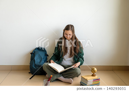 Teenage student holding books on white background 140293031
