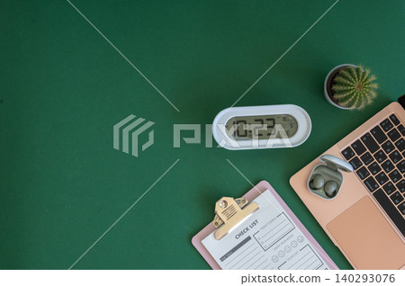 Colorful school supplies on a green background 140293076