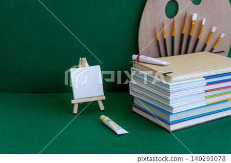 Colorful school supplies on a green background Colorful school supplies on a green background 140293078