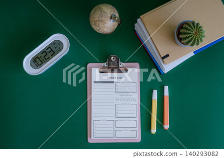 Colorful school supplies on a green background Colorful school supplies on a green background 140293082