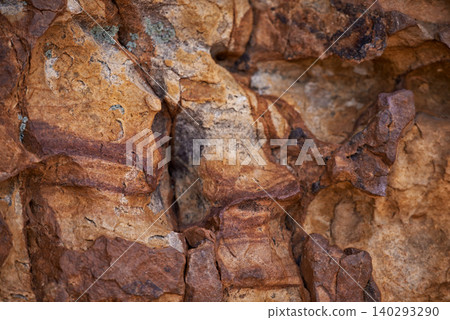 Rock face, closeup and mountain in nature, natural or travel outdoor with wall. Cliff, stone and environment for bouldering, climbing and texture of surface in summer on a background in South Africa Rock face, closeup and mountain in nature, natural or travel outdoor with wall. Cliff, stone and environment for bouldering, climbing and texture of surface in summer on a background in South Africa 140293290