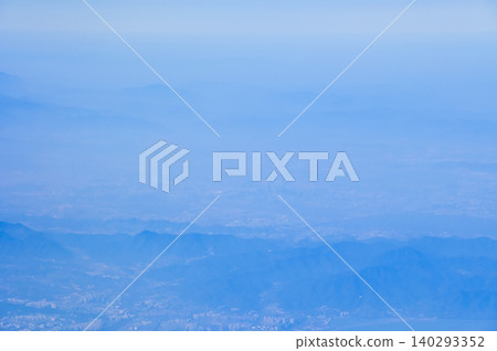 The view of China city from the airplane window. Aerial view of cityscape, the land of China, Asia. Travel and landscape scene. Travel and nature concept. The view of China city from the airplane window. Aerial view of cityscape, the land of China, Asia. Travel and landscape scene. Travel and nature concept. 140293352