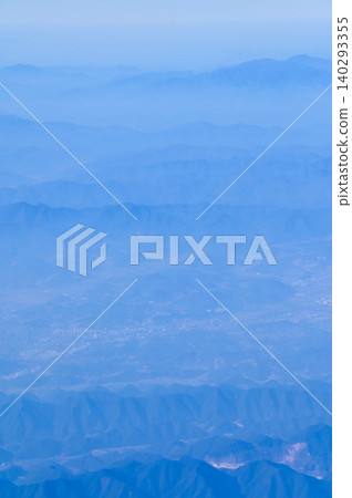 The view of China city from the airplane window. Aerial view of cityscape, the land of China, Asia. Travel and landscape scene. Travel and nature concept. The view of China city from the airplane window. Aerial view of cityscape, the land of China, Asia. Travel and landscape scene. Travel and nature concept. 140293355