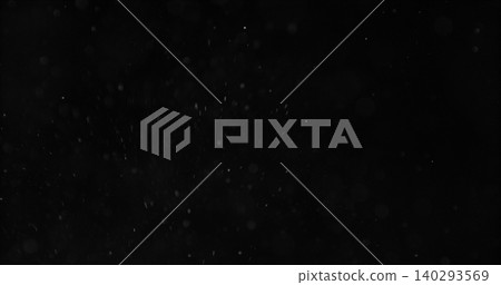 Realistic falling snow and airborne dust particles drifting through dark space. Atmospheric winter storm effect on black background, ideal for overlays, VFX compositing and cinematic scenes. 140293569