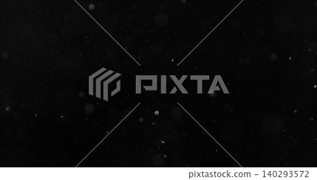 Realistic falling snow and airborne dust particles drifting through dark space. Atmospheric winter storm effect on black background, ideal for overlays, VFX compositing and cinematic scenes. 140293572