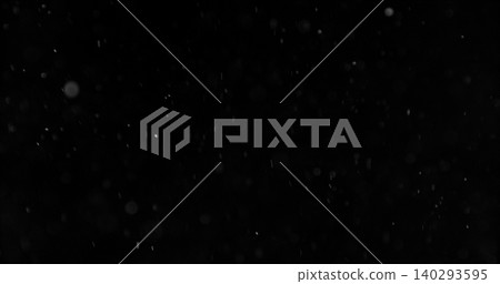 Realistic falling snow and airborne dust particles drifting through dark space. Atmospheric winter storm effect on black background, ideal for overlays, VFX compositing and cinematic scenes. 140293595