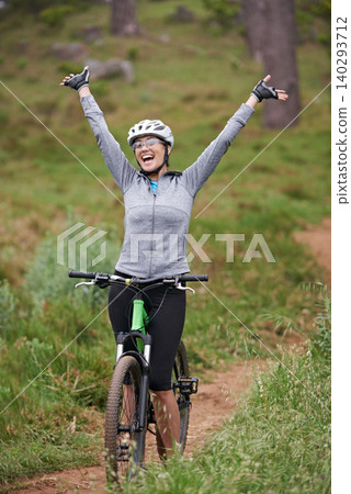 Cycling, fitness and woman success in nature for celebration, achievement and goals in training or journey. Excited person or winner with arms up for freedom, winning and yes on bicycle on mountains Cycling, fitness and woman success in nature for celebration, achievement and goals in training or journey. Excited person or winner with arms up for freedom, winning and yes on bicycle on mountains 140293712