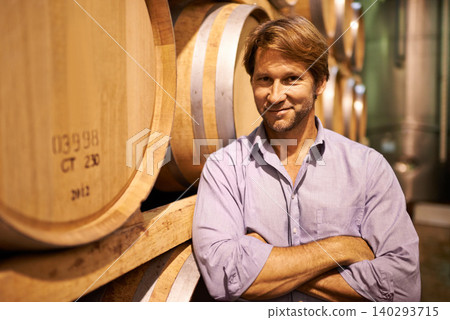 Portrait, smile and wine tasting with a man in the cellar of a distillery on a farm for the production of alcohol. Glass, industry and barrel with a happy male farmer or sommelier for quality control Portrait, smile and wine tasting with a man in the cellar of a distillery on a farm for the production of alcohol. Glass, industry and barrel with a happy male farmer or sommelier for quality control 140293715