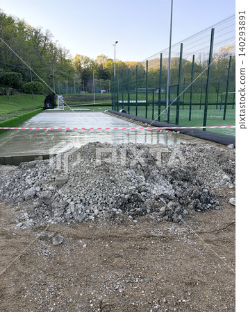 The outdoor construction site area is cordoned off with red and white tape. construction work at a sports facility The outdoor construction site area is cordoned off with red and white tape. construction work at a sports facility 140293891