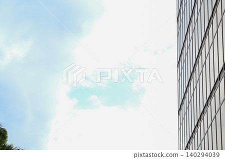 Dramatic skyscape and cloudscape with the bright sun and sunlight. Looking up to the sky. Focus on the sun. Nature scene. Dramatic skyscape and cloudscape with the bright sun and sunlight. Looking up to the sky. Focus on the sun. Nature scene. 140294039