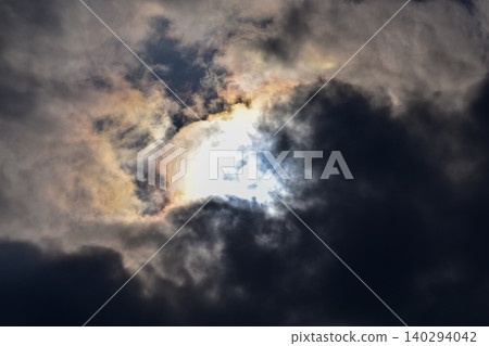 Dramatic skyscape and cloudscape with the bright sun and sunlight. Looking up to the sky. Focus on the sun. Nature scene. Dramatic skyscape and cloudscape with the bright sun and sunlight. Looking up to the sky. Focus on the sun. Nature scene. 140294042