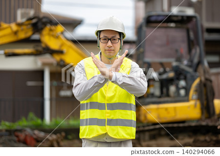 A worker making a "no" sign 140294066
