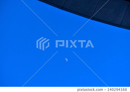 Close-up of the moon in the sky. Looking up to the sky. Nature concept. Close-up of the moon in the sky. Looking up to the sky. Nature concept. 140294168