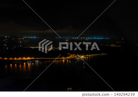 The view of Hong Kong seascape from airplane window. Hong Kong scene from above. Travel and landscape concept. The view of Hong Kong seascape from airplane window. Hong Kong scene from above. Travel and landscape concept. 140294239