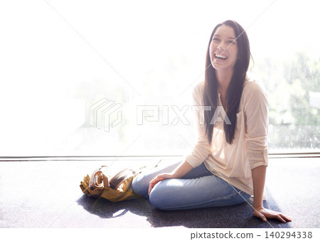 Woman, university and student with laugh for sitting on floor with backpack, campus and break for joke. Female person, education and college with happiness for fun, enjoy and academics to relax Woman, university and student with laugh for sitting on floor with backpack, campus and break for joke. Female person, education and college with happiness for fun, enjoy and academics to relax 140294338