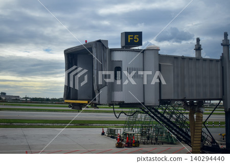 Airport scene with the Jet bridge. Waiting to aboard. Travel and transportation scene. Airport scene with the Jet bridge. Waiting to aboard. Travel and transportation scene. 140294440