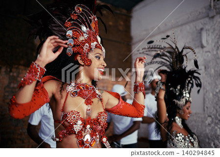 Smile, dance and women at carnival in costume for celebration, music culture and happy band in Brazil. Samba, party and girl friends together at festival, parade or stage show in Rio de Janeiro. 140294845