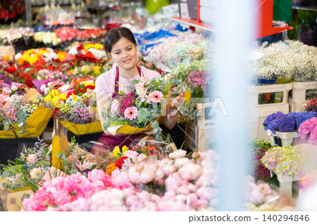 Portrait of female flower market seller with bouquets of flowers Portrait of female flower market seller with bouquets of flowers 140294846