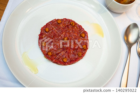 Beef tartare with rich yolk sauce and crusty toasts Beef tartare with rich yolk sauce and crusty toasts 140295022