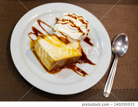 Creamy flan served on platter for dessert Creamy flan served on platter for dessert 140295033