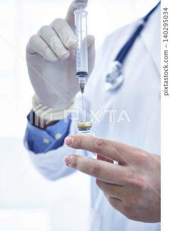 Doctor, hand and syringe in bottle or vaccine medication with needle or healthcare treatment, prescription or help. Person, worker, fingers and gloves or immunization injection for sick, flu or shot Doctor, hand and syringe in bottle or vaccine medication with needle or healthcare treatment, prescription or help. Person, worker, fingers and gloves or immunization injection for sick, flu or shot 140295034