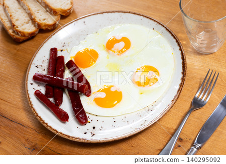 Huevos con chistorra. Scrambled eggs with sausage Huevos con chistorra. Scrambled eggs with sausage 140295092