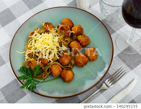 Portion of albondigas meatballs with side dish pasta Portion of albondigas meatballs with side dish pasta 140295155