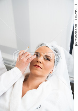 Woman receiving cosmetic treatment in a spa during daytime 140295191