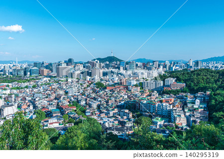 Panoramic view of downtown Seoul city skyline and Namsan Seoul Tower from Inwangsan Mountain on a clear summer day 140295319
