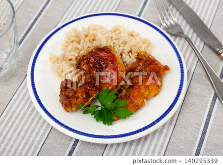 Fried chicken pieces served with rice Fried chicken pieces served with rice 140295339