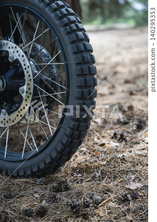 Off Road Motorcycle Wheel On Forest Trail Off Road Motorcycle Wheel On Forest Trail 140295353