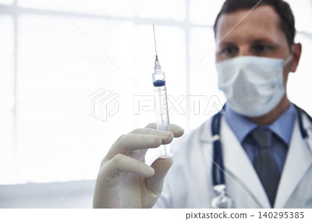 Doctor, syringe and vaccine injection with needle for disease treatment for influenza virus, antibiotic or healthcare. Male person, face mask and immunization shot in hospital, booster or prevention Doctor, syringe and vaccine injection with needle for disease treatment for influenza virus, antibiotic or healthcare. Male person, face mask and immunization shot in hospital, booster or prevention 140295385