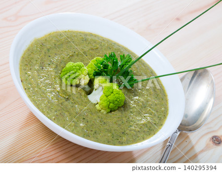 Dish of Norwegian cuisine, cream soup from broccoli with soft cheese Dish of Norwegian cuisine, cream soup from broccoli with soft cheese 140295394