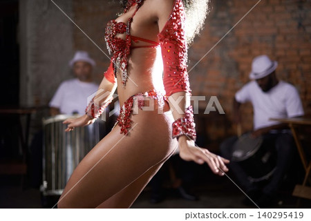 Carnival, dance and woman in costume at night for street performance, entertainment and talent. Samba dancer, fashion and body of person with feathers for celebration, festival and holiday in Brazil 140295419