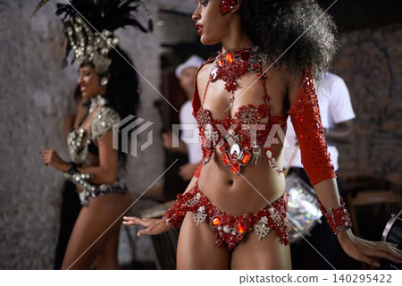 Woman, samba dancer and friends in performance with costume for tradition at carnival or festival. Brazilian female person, exotic performer and band for culture or dancing at party or concert in Rio Woman, samba dancer and friends in performance with costume for tradition at carnival or festival. Brazilian female person, exotic performer and band for culture or dancing at party or concert in Rio 140295422
