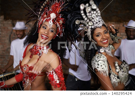 Portrait, dance and carnival with women in Rio de Janeiro for music, festival or celebration of culture. Brazil, party and smile with happy dancer people outdoor for performance, show or tradition Portrait, dance and carnival with women in Rio de Janeiro for music, festival or celebration of culture. Brazil, party and smile with happy dancer people outdoor for performance, show or tradition 140295424