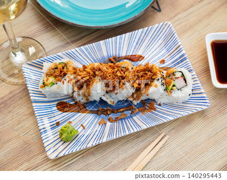 Curry roll - rolls with avocado, crab, cucumber and fried onion. Japanese traditional food Curry roll - rolls with avocado, crab, cucumber and fried onion. Japanese traditional food 140295443