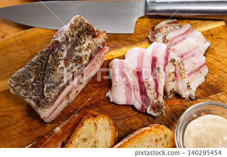 Sliced lard served with horseradish and bread Sliced lard served with horseradish and bread 140295454
