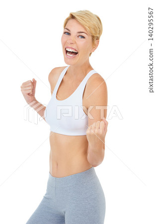 Woman, portrait and success in studio for fitness achievement, training and victory on white background. Workout model, person and winner fist for health, exercise and wellness on mockup backdrop 140295567