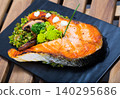 Deliciously steak of fried salmon with with broccoli on plate 140295686