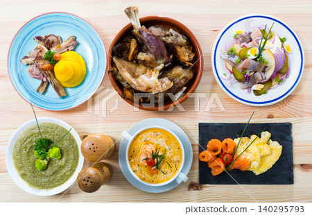 Dishes of traditional Norwegian cuisine with lamb rib, seafood and vegetables 140295793