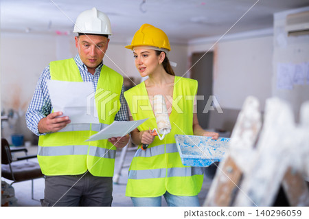 Foreman and house painter at renovating object Foreman and house painter at renovating object 140296059