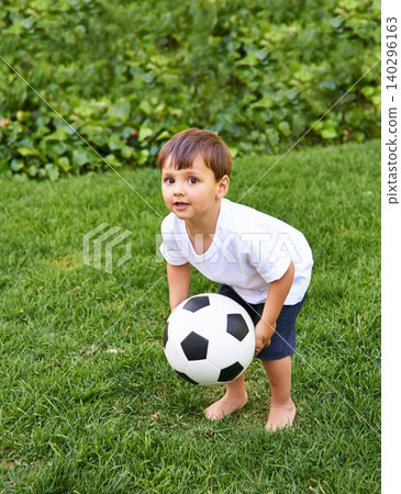 Portrait, boy or catch with soccer ball in park for fun, health or childhood development in Portugal. Happy, confident and male child with football for game or exercise in backyard or garden Portrait, boy or catch with soccer ball in park for fun, health or childhood development in Portugal. Happy, confident and male child with football for game or exercise in backyard or garden 140296163