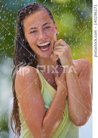Woman, rain and portrait with laughing from summer climate, water and weather outdoor in park. Happy, travel and female person with funny joke from raindrops on holiday and vacation with trip and joy Woman, rain and portrait with laughing from summer climate, water and weather outdoor in park. Happy, travel and female person with funny joke from raindrops on holiday and vacation with trip and joy 140296271