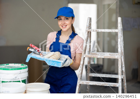 Female painter posing in apartment being renovated Female painter posing in apartment being renovated 140296451