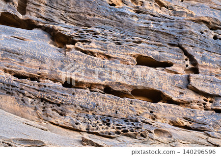 Ancient inscriptions and rock carvings on the sandstone cliffs of Jabal Ikmah in AlUla, Saudi Arabia Ancient inscriptions and rock carvings on the sandstone cliffs of Jabal Ikmah in AlUla, Saudi Arabia 140296596