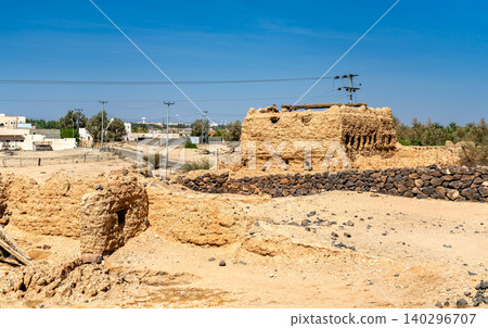 Detailed view of the historic mudbrick ruins of Shanqal Fort located in the desert landscape of Turbah within the Makkah Province of Saudi Arabia. Detailed view of the historic mudbrick ruins of Shanqal Fort located in the desert landscape of Turbah within the Makkah Province of Saudi Arabia. 140296707