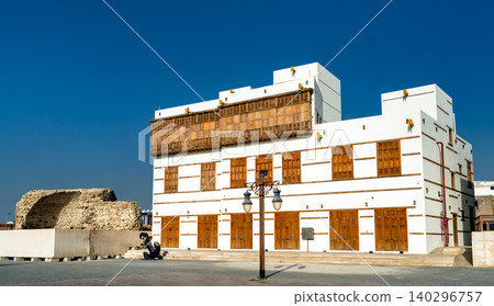 Beautifully restored white building with traditional wooden mashrabiya windows in the Yanbu Historic Area of Saudi Arabia. Beautifully restored white building with traditional wooden mashrabiya windows in the Yanbu Historic Area of Saudi Arabia. 140296757