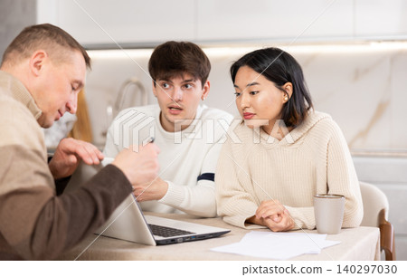 young woman and guy discussing deal with agent young woman and guy discussing deal with agent 140297030